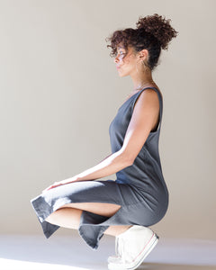 Model, Natalia, wearing the Charcoal romp around reversible dress. The side slit is showing. Size M shown. 