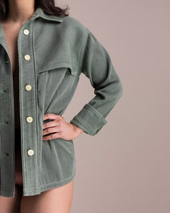 Model, Gia, wearing Soluna Collective's Sage Utility jacket. Front shown with a close up of the pleated fabric. Size M shown.