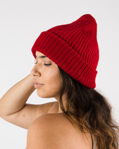 Poppy cozy knit beanie. Side view shown.