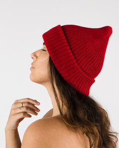 Poppy cozy knit beanie. Side view shown.